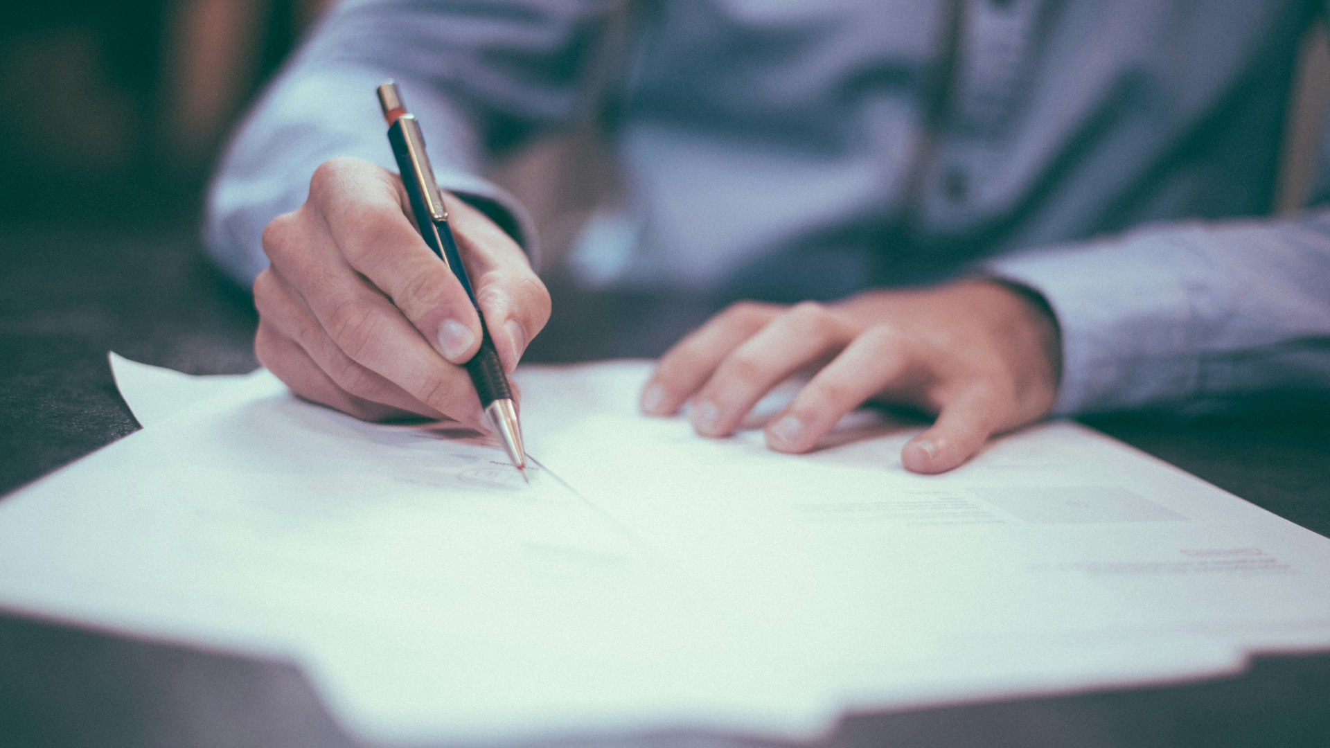 Man writing on paper