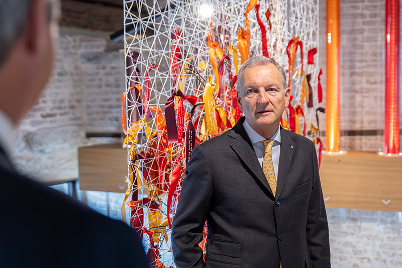 Photo 2 | Aimone Bonsi, standing in front of the artwork ‘Gratitude’ from the permanent interactive exhibition ‘A World of Potential’, curated by Orna Cohen and designed by Studio Migliore+Servetto, at The Human Safety Net House in the Procuratie in Venice.